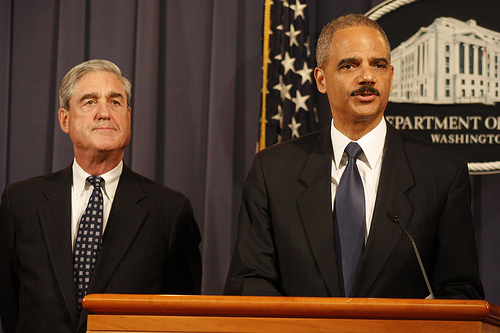 Attorney General Eric Holder (Right). 