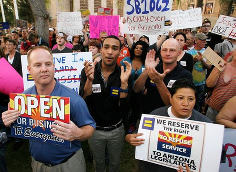 A crowd gathered in Arizona to encourage Gov. Jan Brewer to veto SB1062. Photo by Zuma Press.