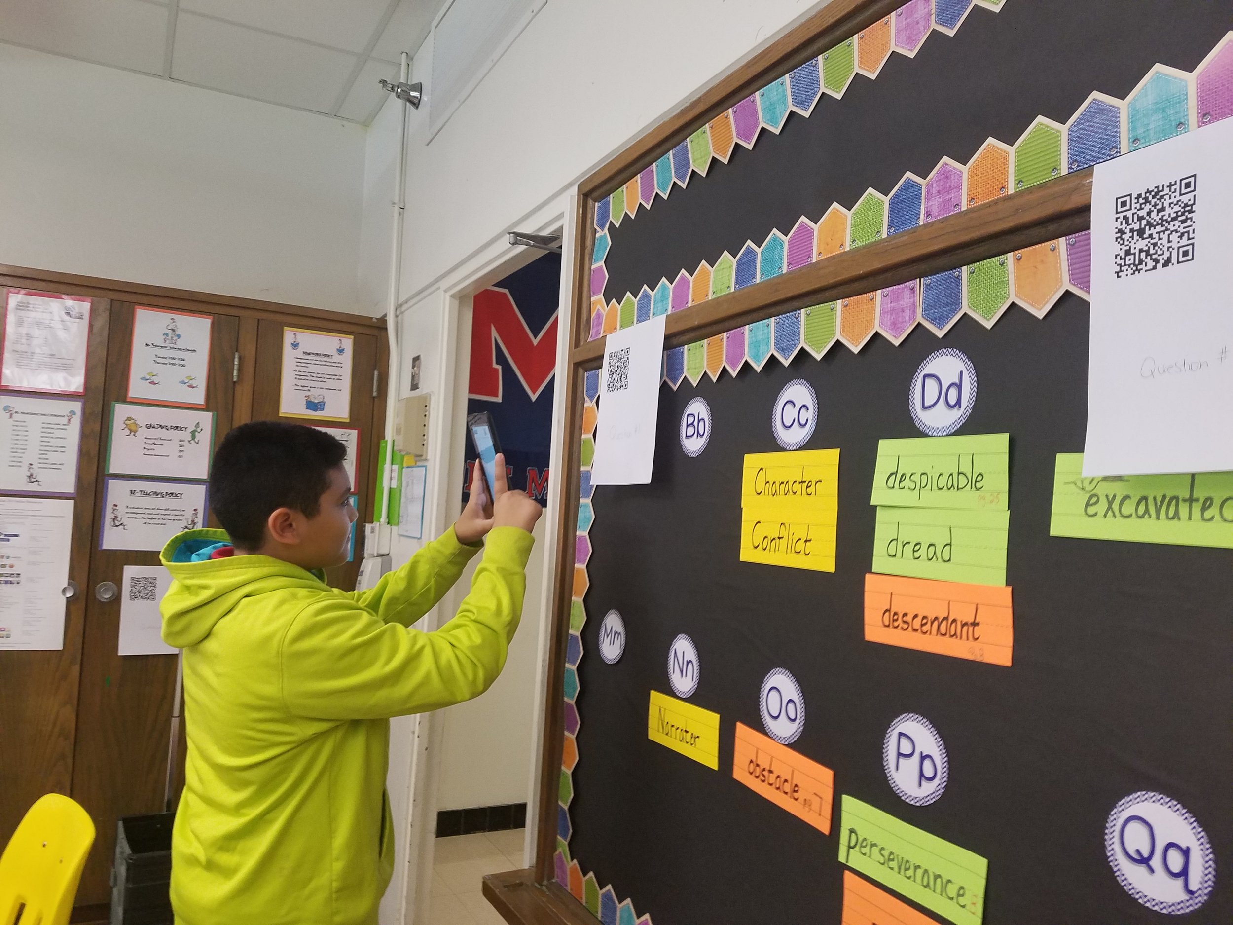 5th grade student at Reilly Elementary using a QR code to access the next part of their class activity.