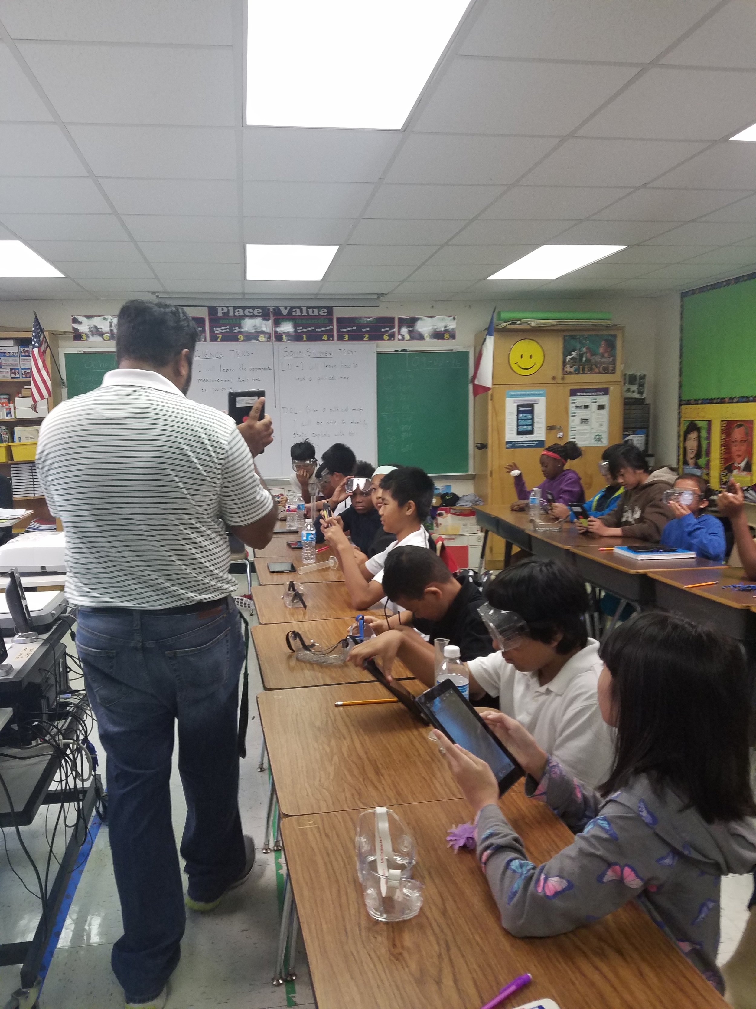 5th grade Science class at Gill Elementary reviewing the scientific method during a lab.