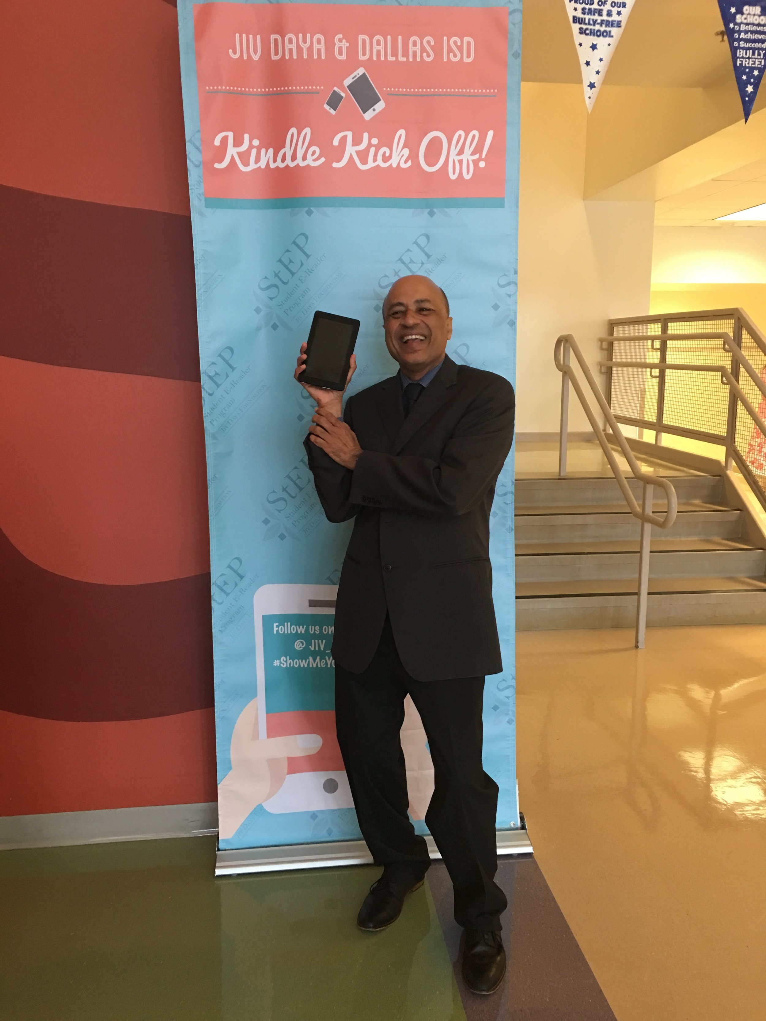  JDF Founder and President, Vinay Jain, showing off his kindle at the Bryan Adams Feeder Teacher training. 