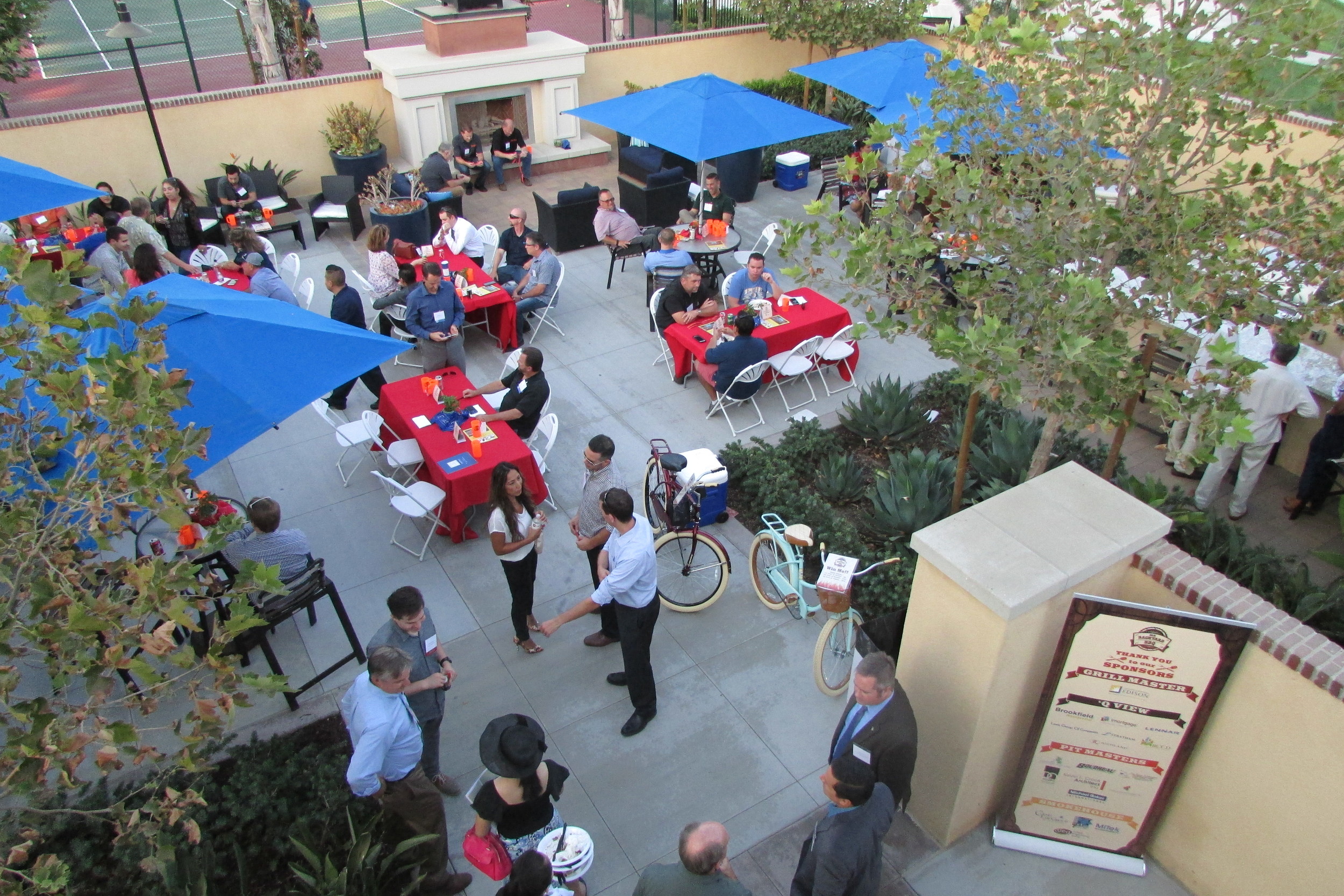 Almost 200 attendees networking while enjoying delicious BBQ at the 2016 Backyard BBQ