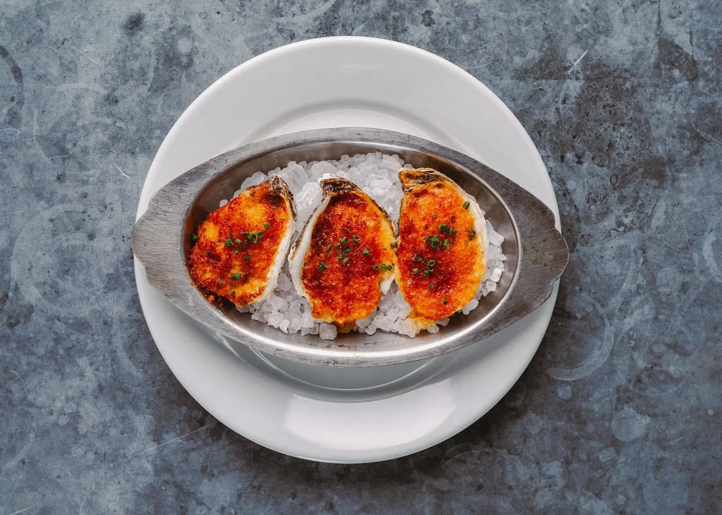 OYSTERS MOSCA a humble nod to one of the most legendary restaurants in south Louisiana @moscas1946 A nduja, parmesan butter crust broiled until crispy. Oysters always on, our air conditioner works, and there&rsquo;s a cool breeze on the patio. Where 