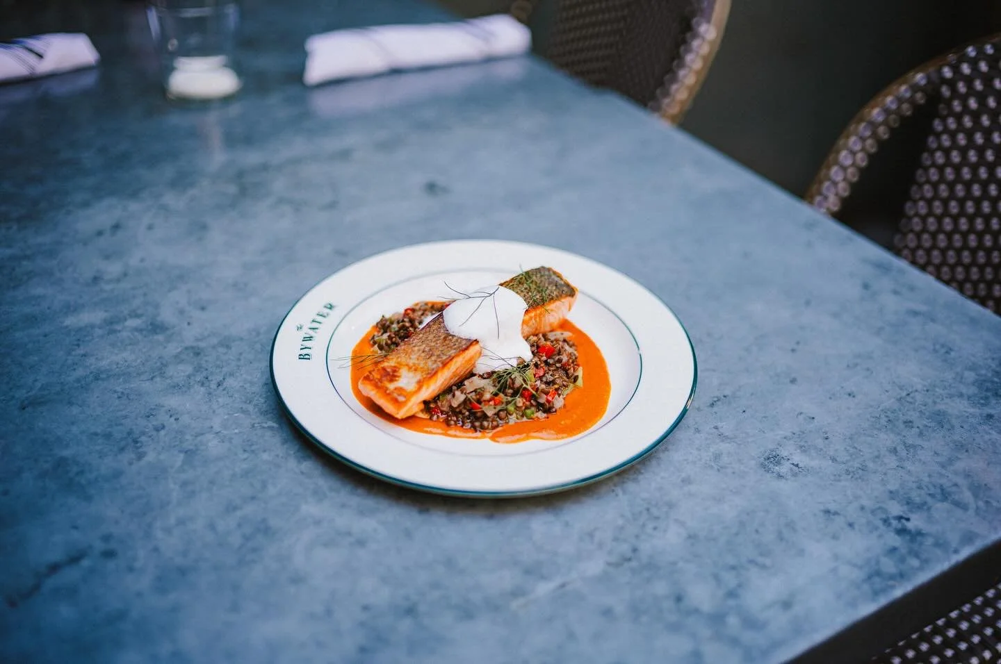 SALMON AND LENTILS IS NOT BORING a dish bridging the gap between past and present, Sauce Am&eacute;ricaine exudes tradition. Lobster shells, shallots, white wine, tomato, classic French cooking. Whipping the yogurt into a foam brings a lighter textur