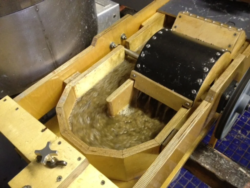 Wooden beater beating flax