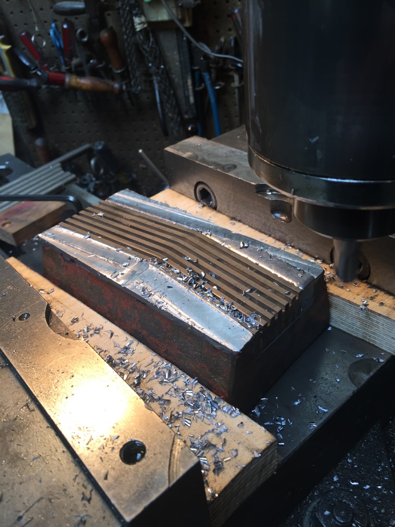 Milling blade retaining metal