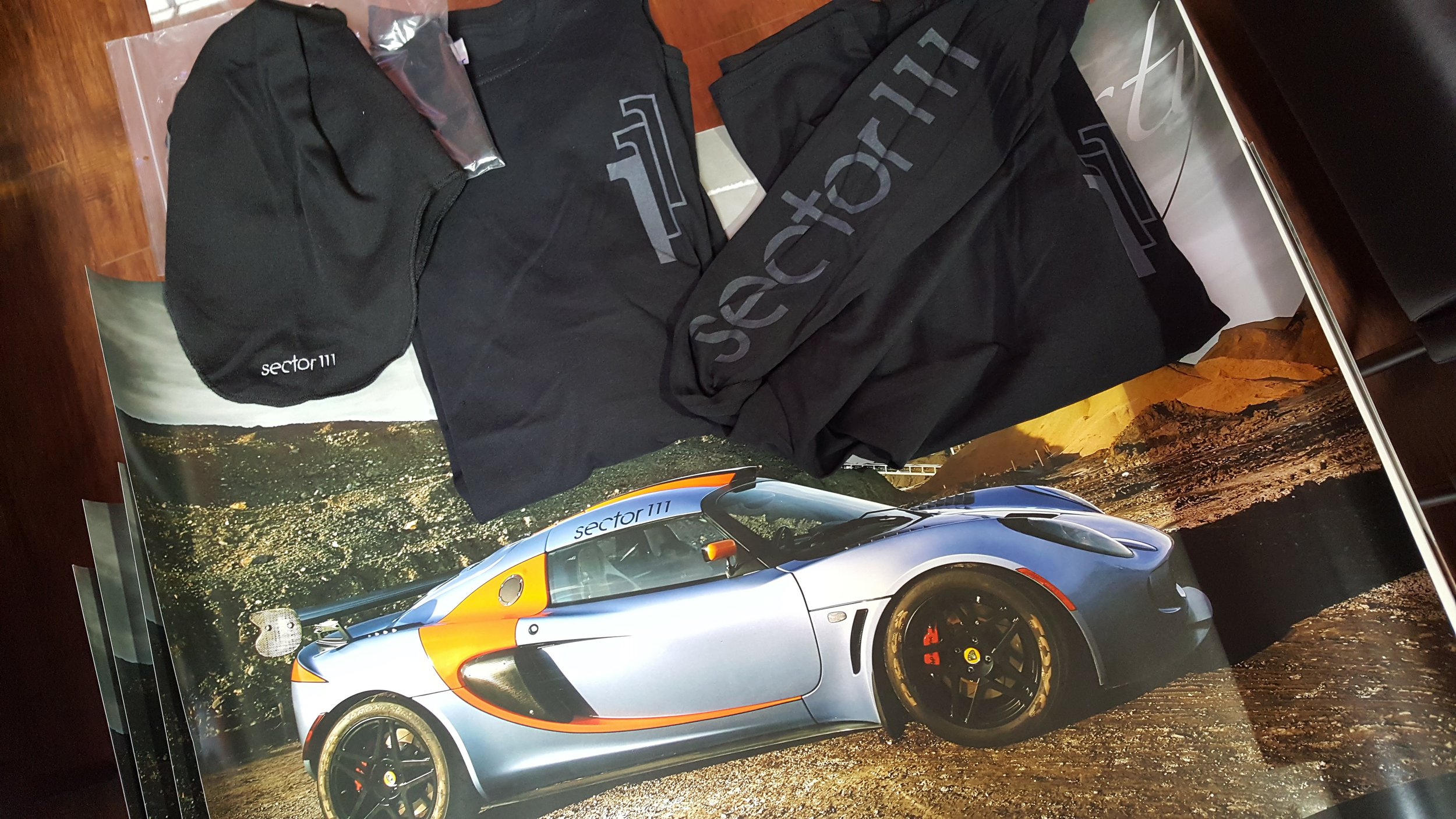 Sector 111 Package: includes 1 long sleeve, 1 balaclava, 1 Exige poster. Estimated value: $80. 1 winner. / 3 posters. Estimated value: $10 each. 3 winners.