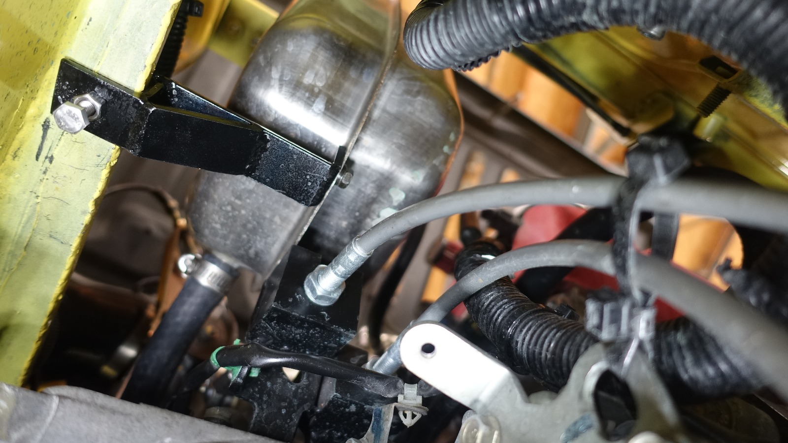 Custom made coolant tank bracket.