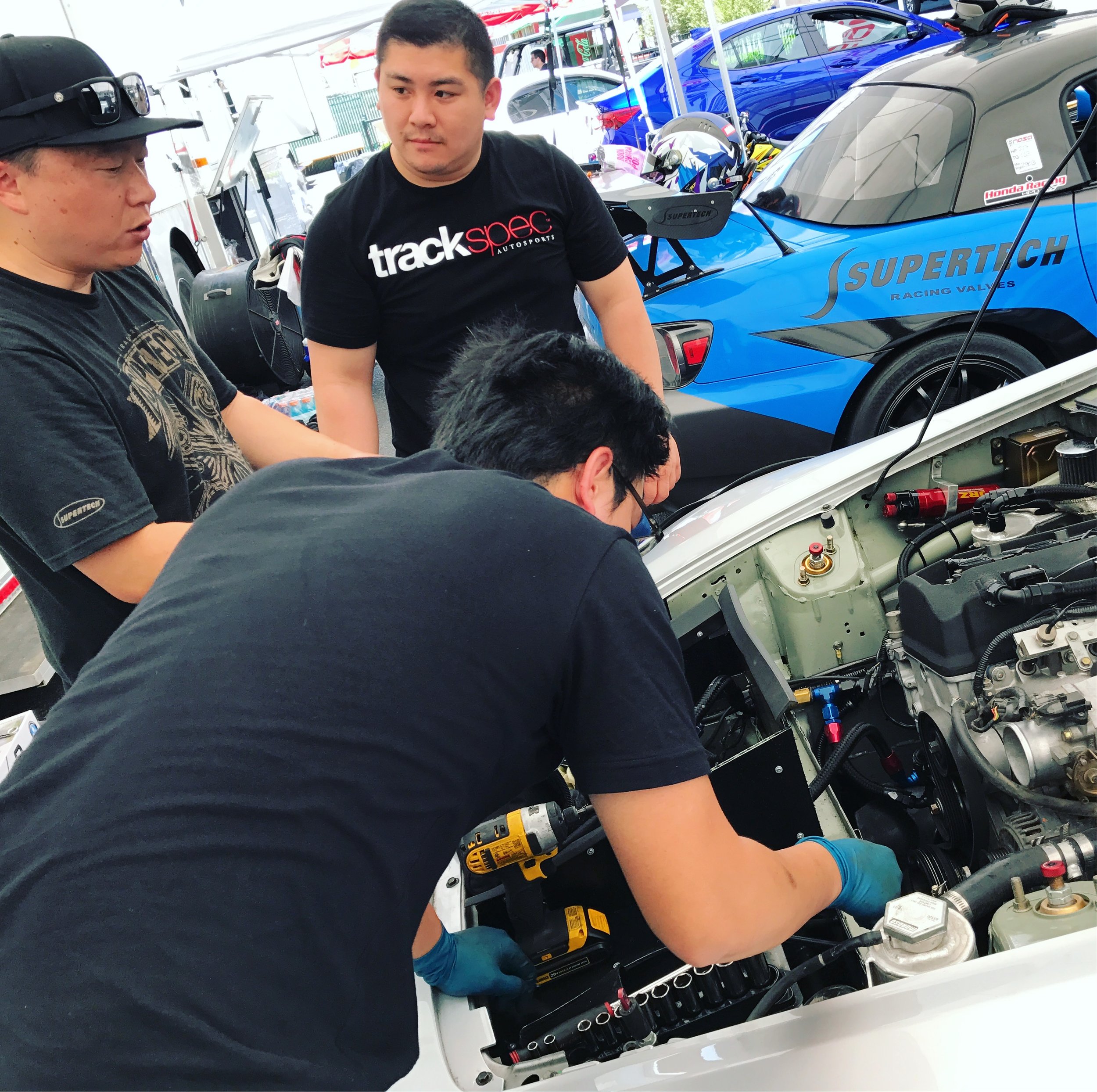 Drew and Son working with my friend and master engine tuner, Jei Chang from Blacktrax Performance