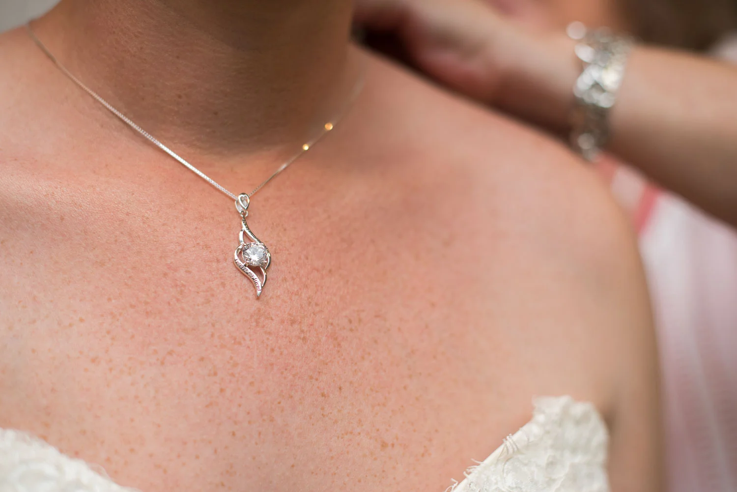 18 Mother of the bride helps put on the necklace she purchased for brittney as a wedding day gift.jpg
