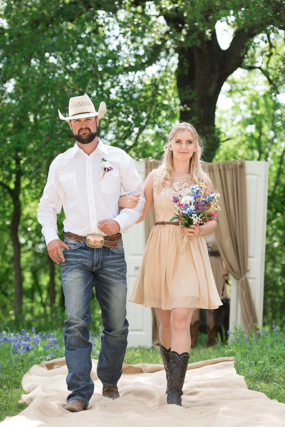 30 Groomsman and bridesmaid walk down aisle made of burlap.jpg
