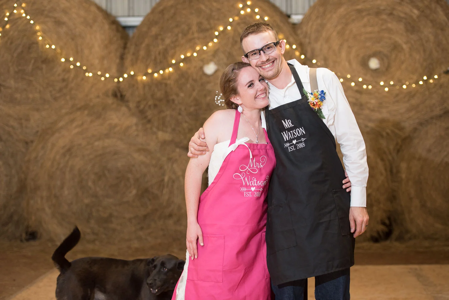 65 bride and groom put on custom barbecue aprons.jpg