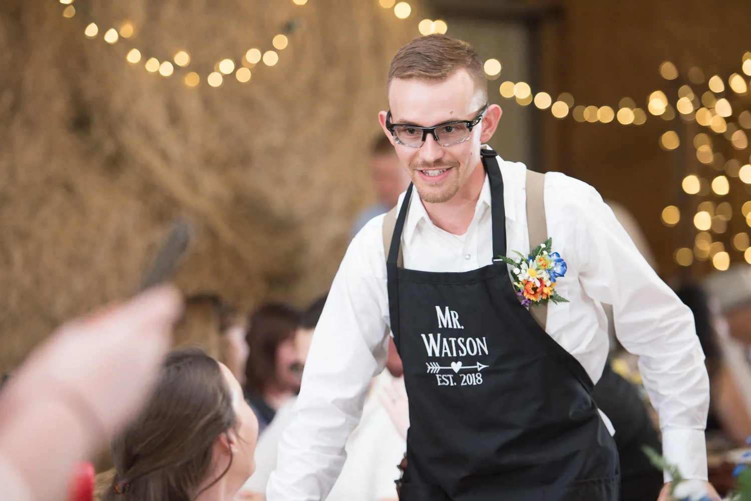 71 groom greets guests as the enjoy their meal.jpg
