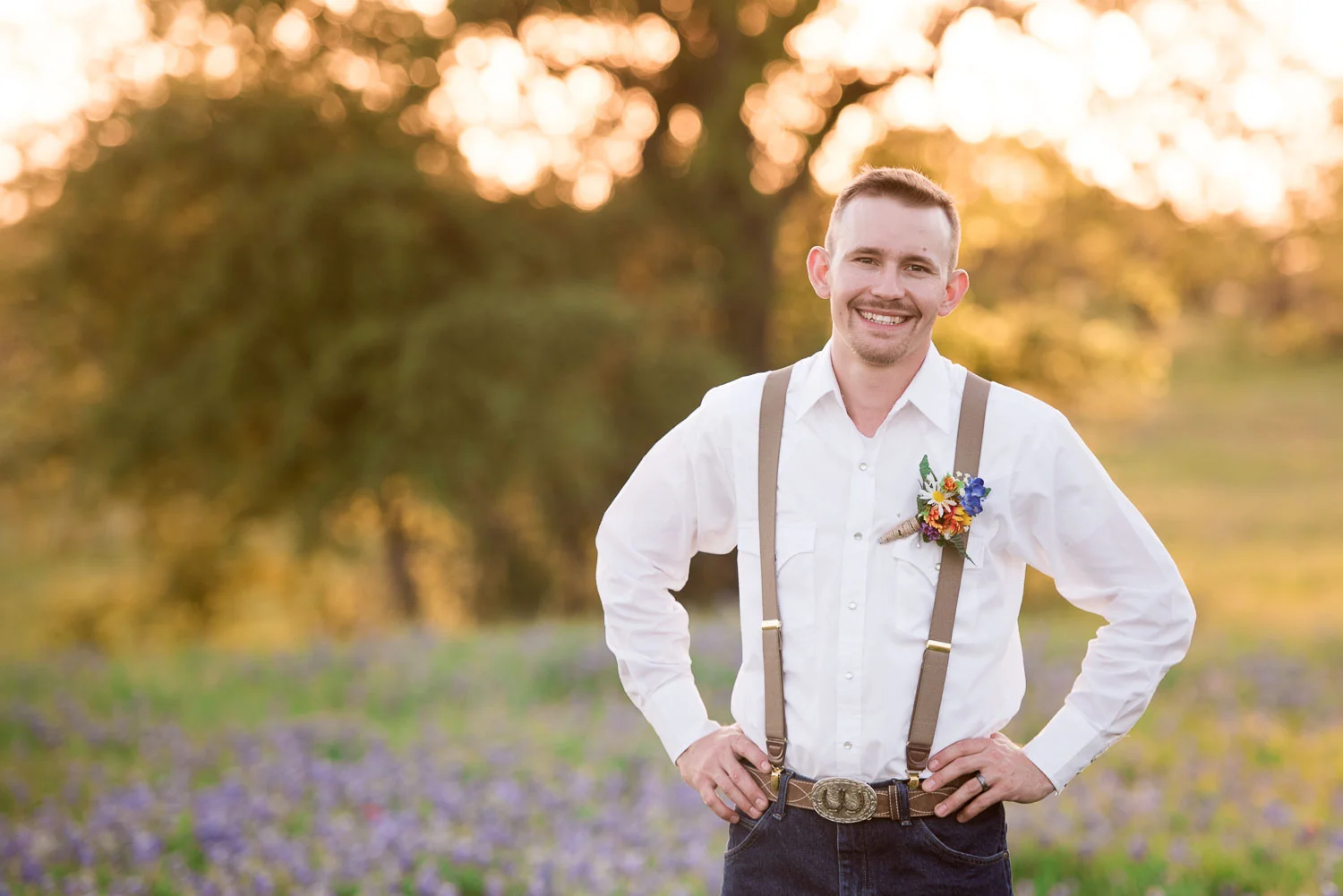 90 groom in suspenders with bouttonnier detail.jpg