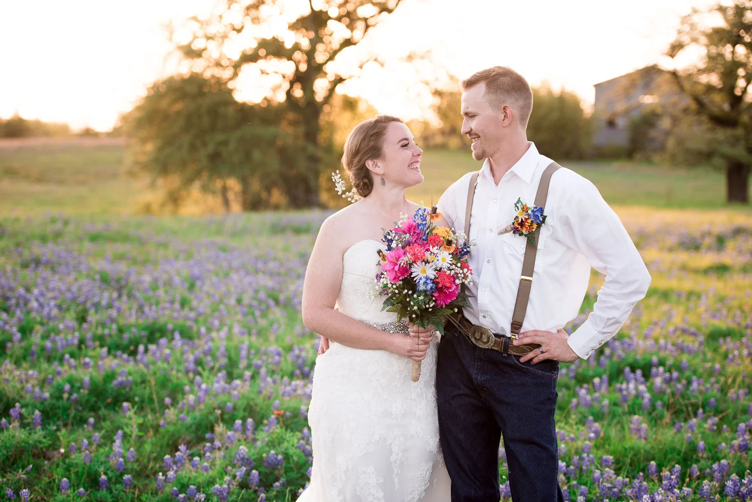 92 bride and groom together in a field of bluebonnets.jpg