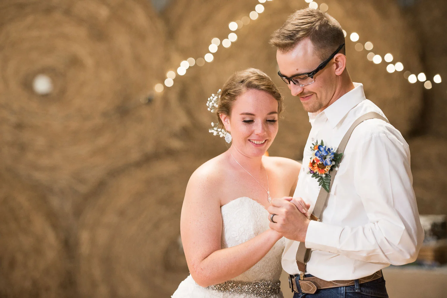 104 first dance with bride and groom in barn reception.jpg
