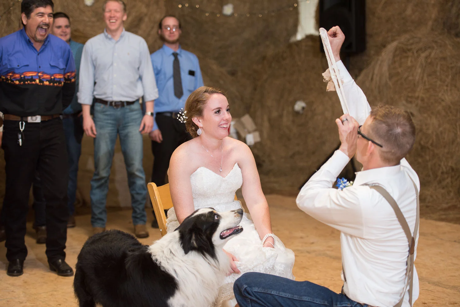 124 groom throws the garter.jpg