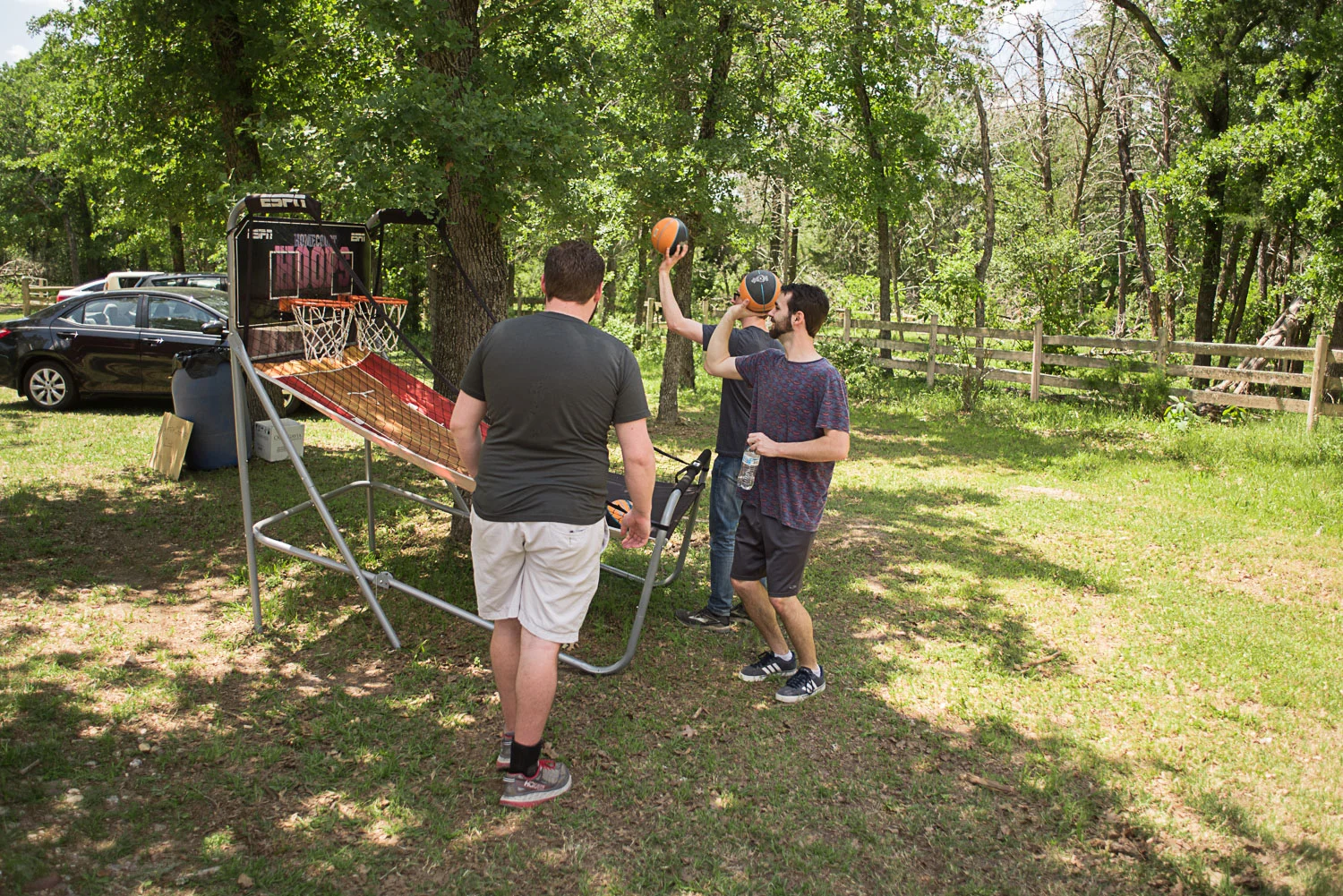 21 groomsmen playing yard games at wedding venue.jpg