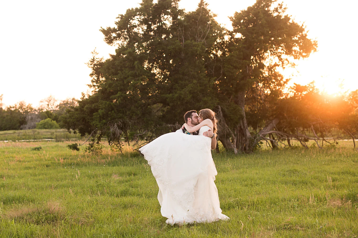 171 bride and groom during golden hour in a field.jpg