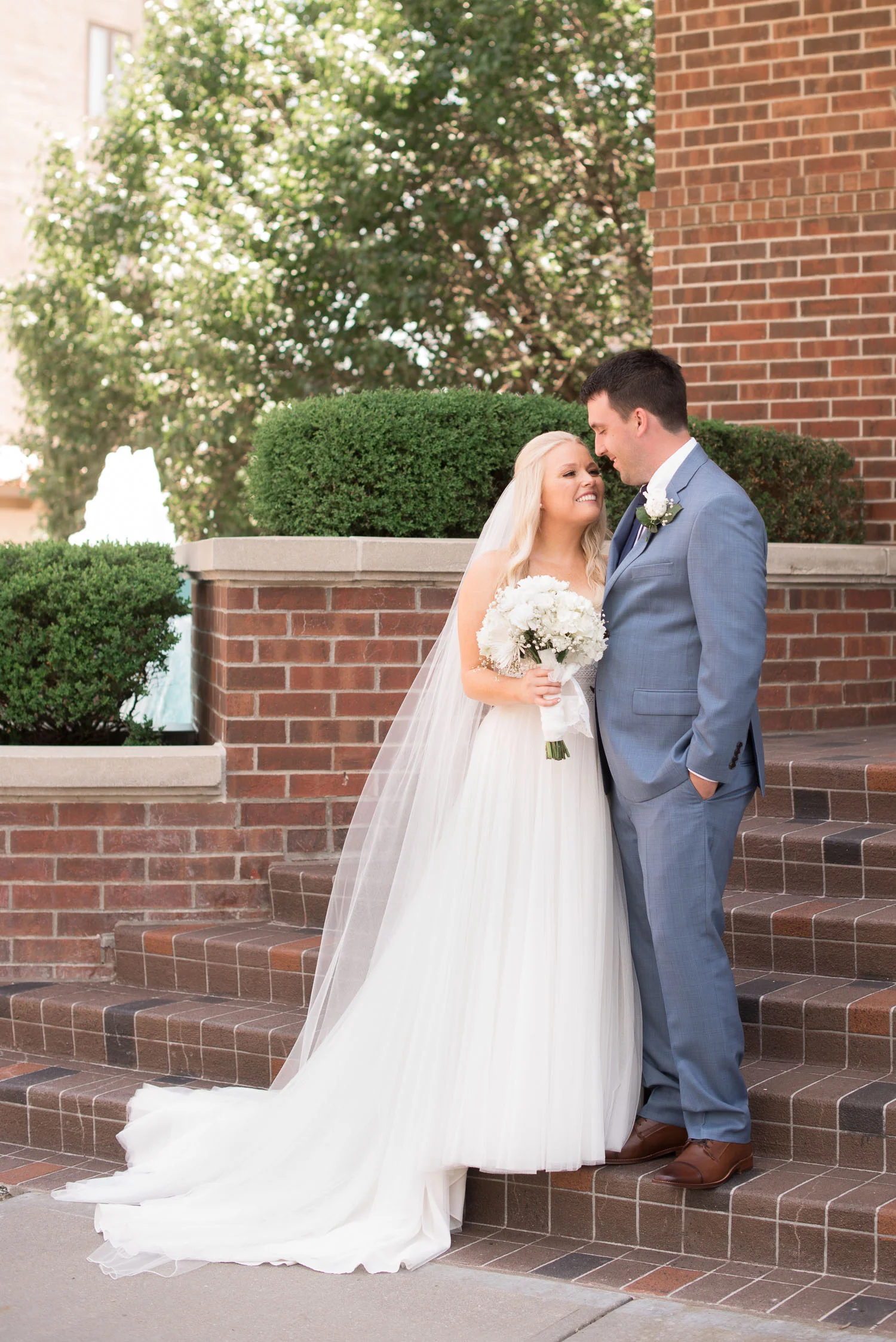 55 bride and groom on broadway in kansas city.jpg