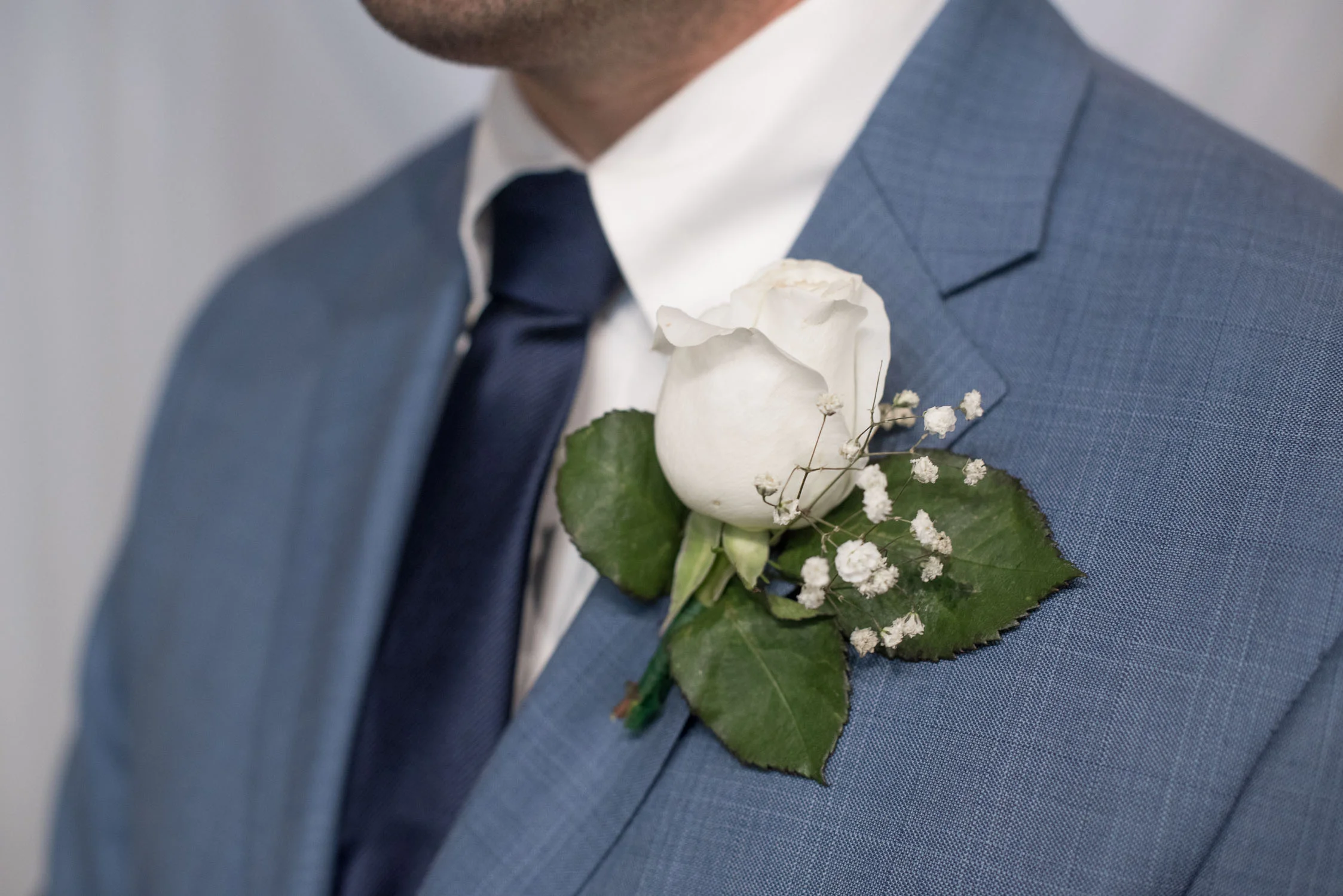 85 white rose boutonniere.jpg
