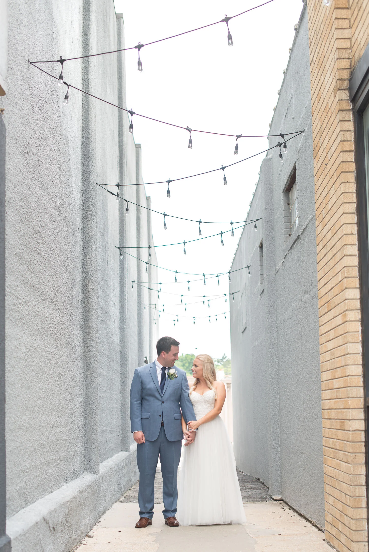 107 bride and groom in mission theater garden.jpg