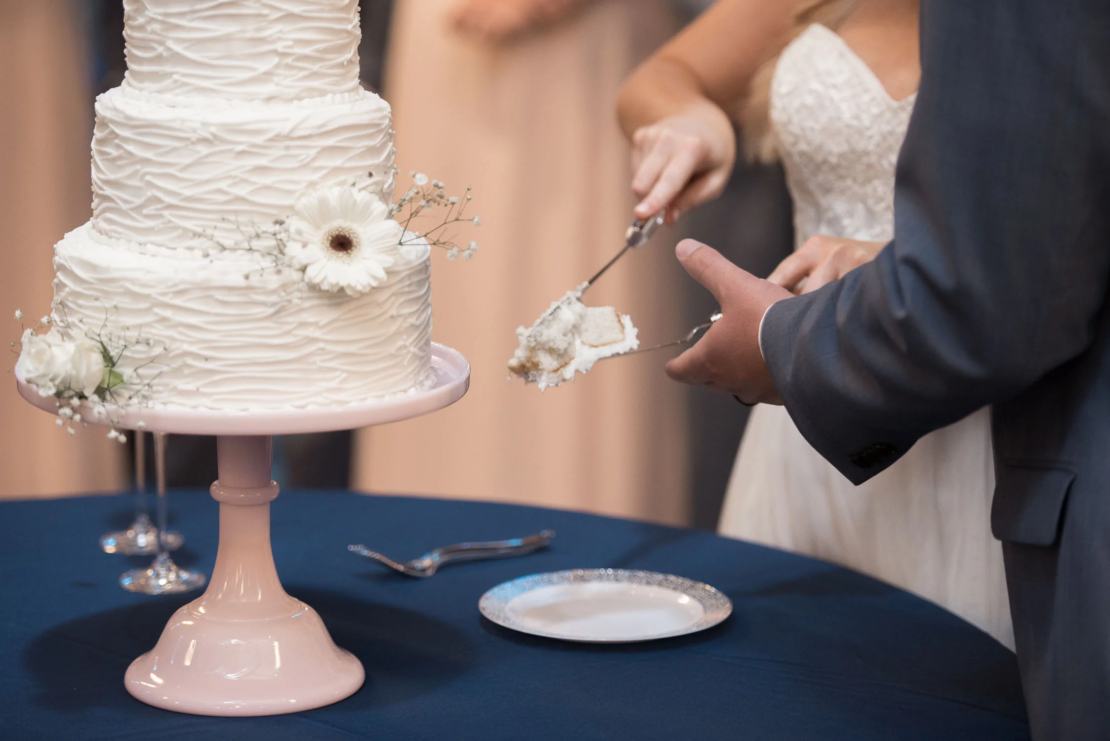 126 Bride and groom sharing slice of cake.jpg