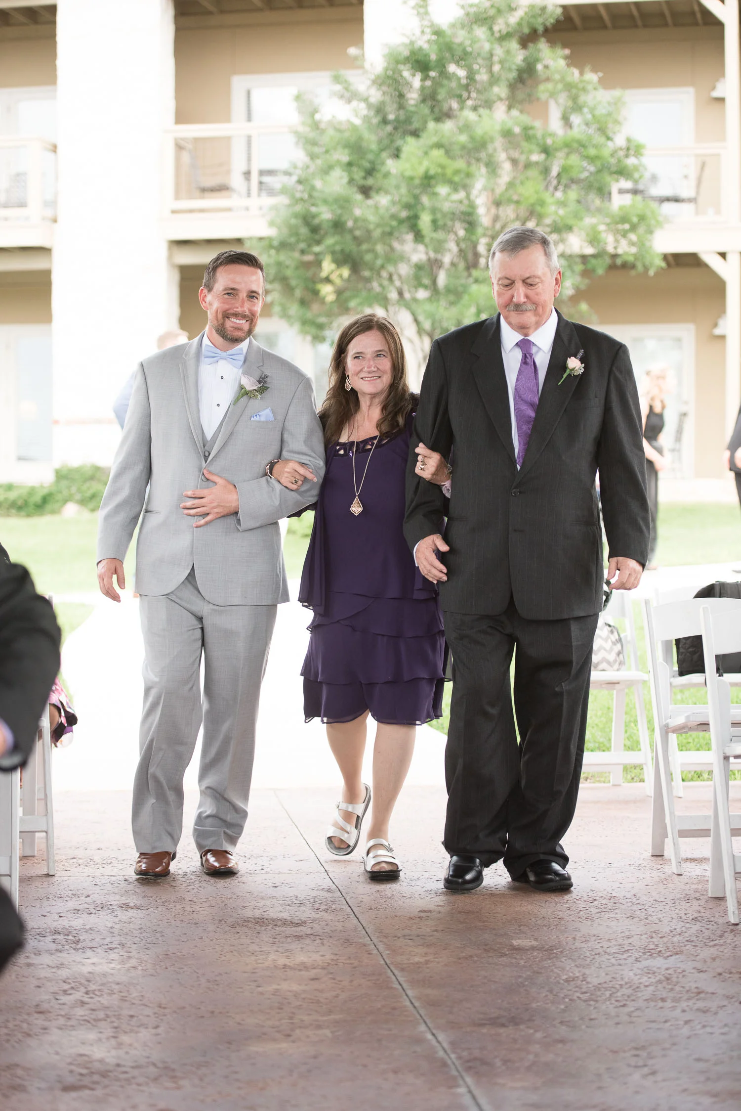 54 groom walking parents down aisle at vintage villas.jpg