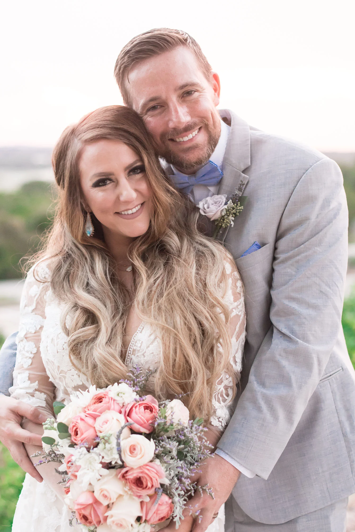 97 bride and groom portraits over lake travis.jpg