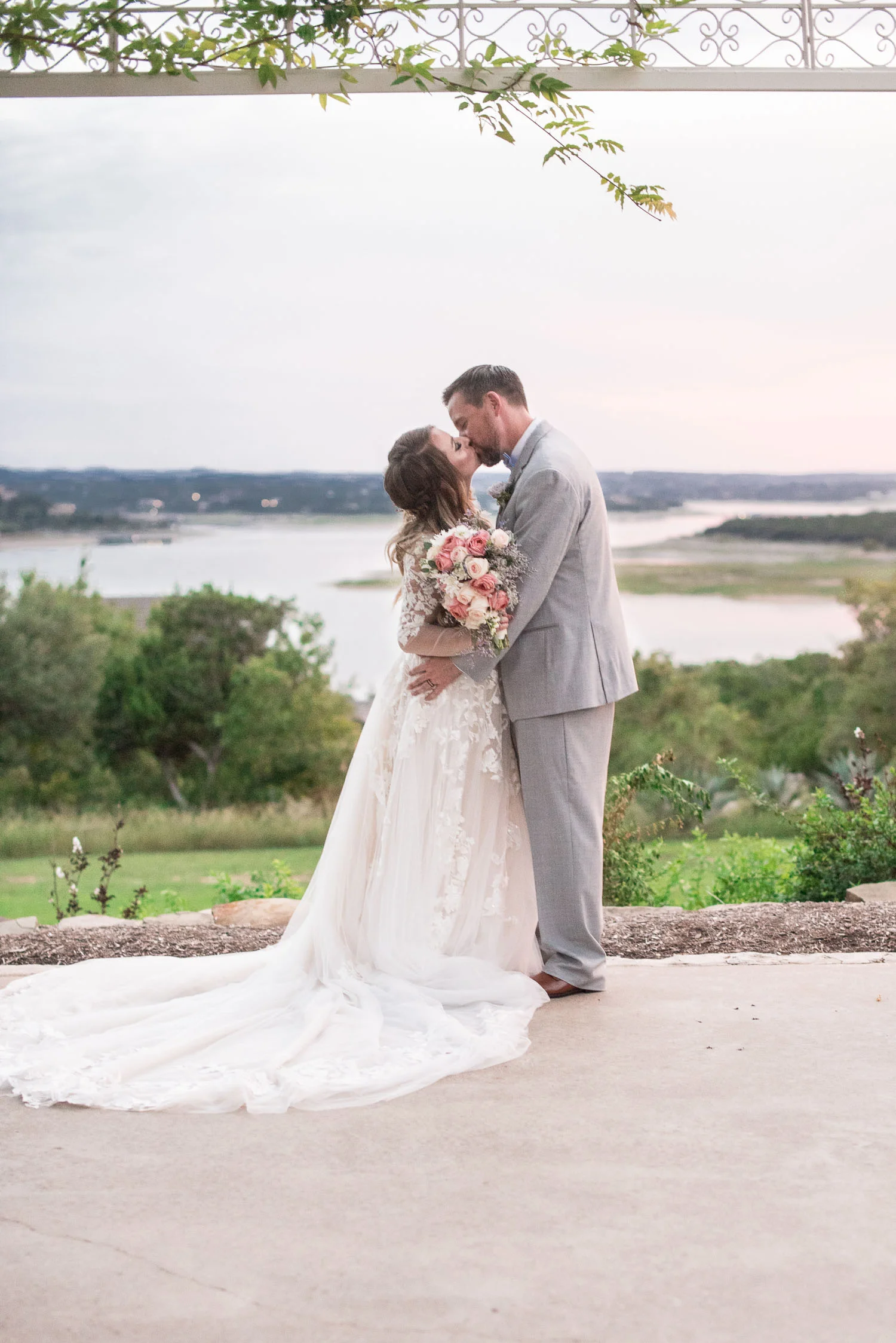 101 bride and groom overlooking lake travis.jpg