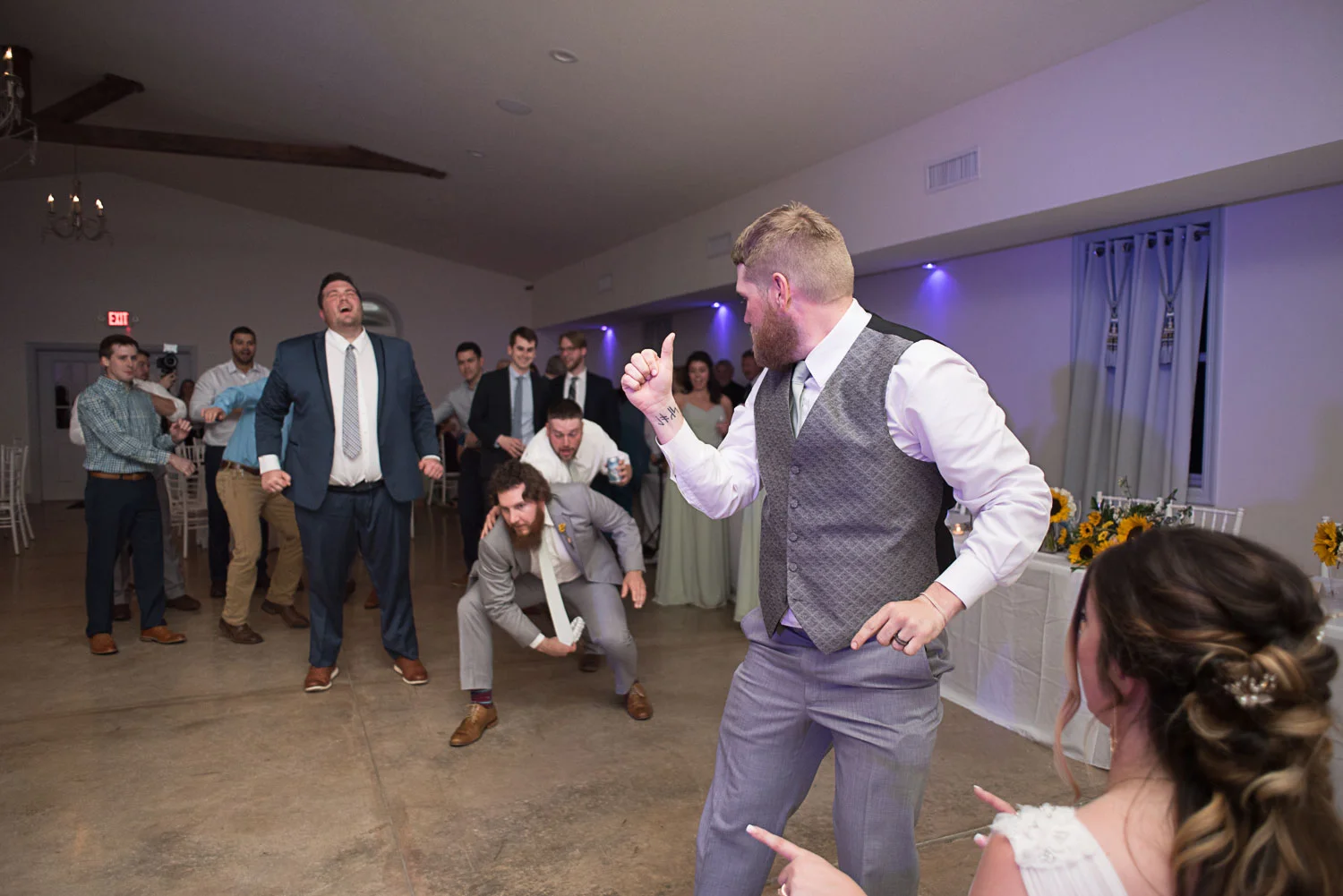 145 garter toss with groomsmen.jpg