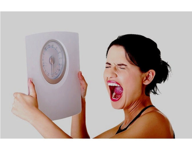 Frustrated-woman-with-scale.jpg