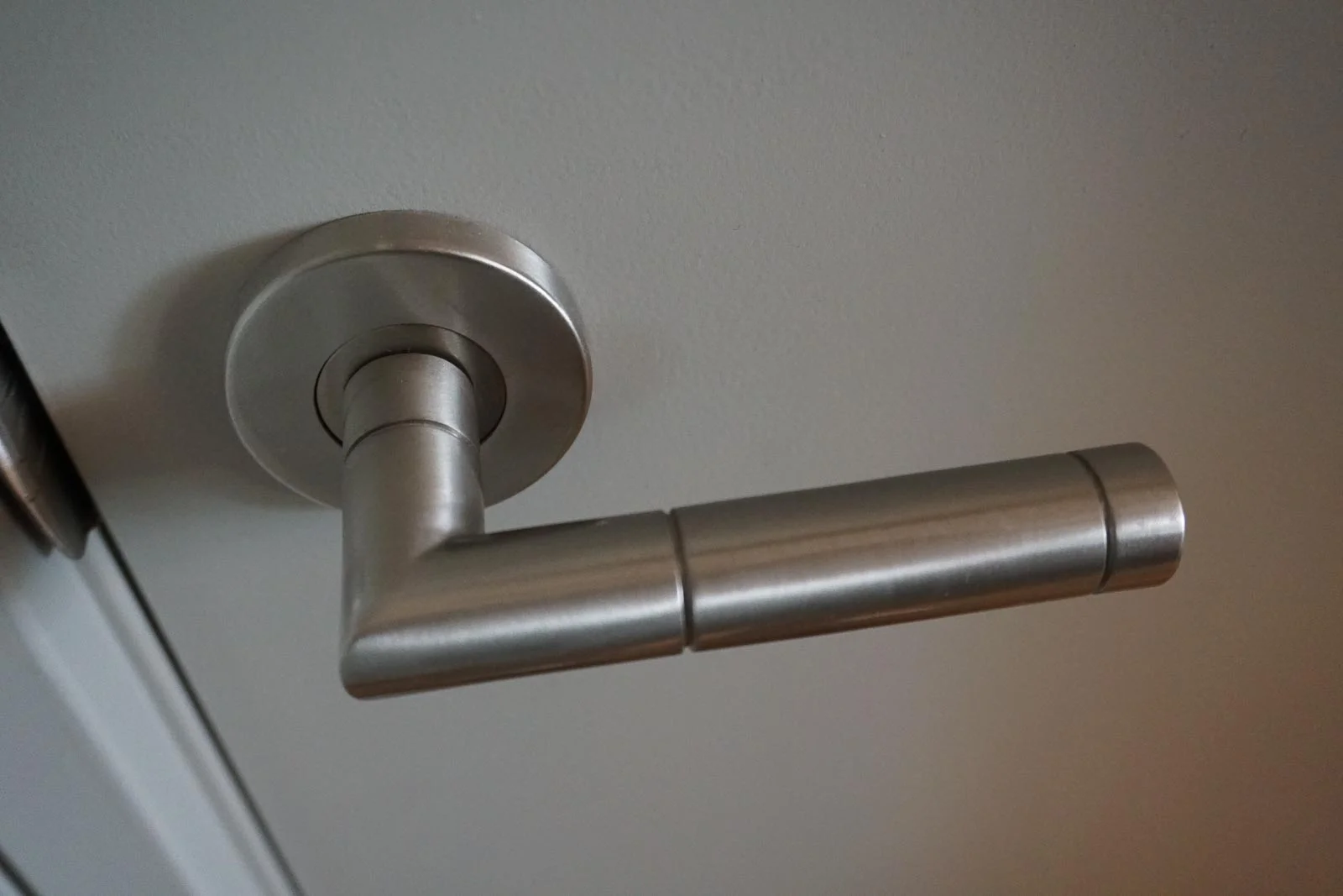 Brushed stainless door levers . . .