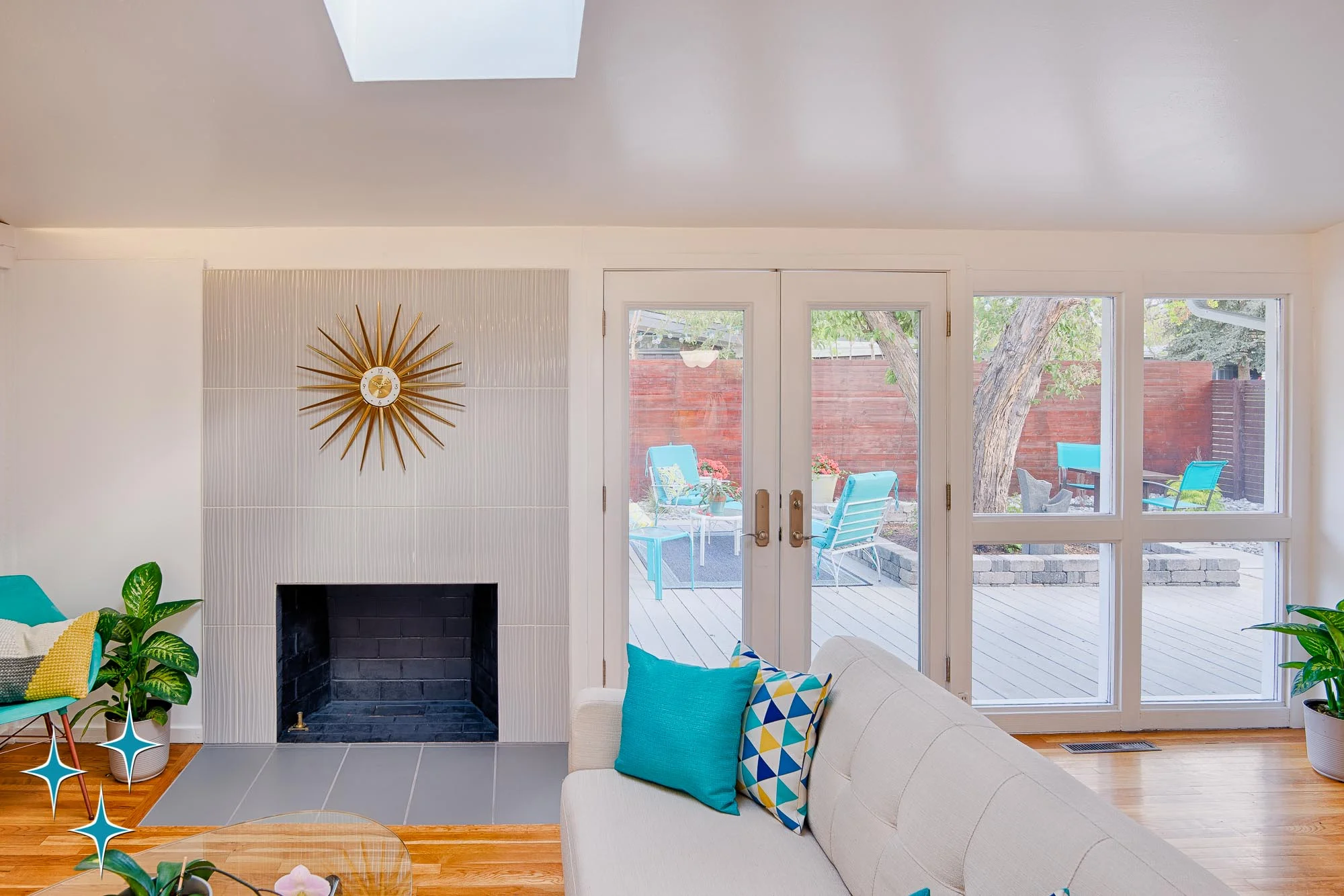 2500 S Meade Street, a Cliff May Home in Denver’s Harvey Park offered by Adrian Kinney, Broker Associate, Resident Realty South Metro. A few of the indoor-outdoor connection to the courtyard from the living room.