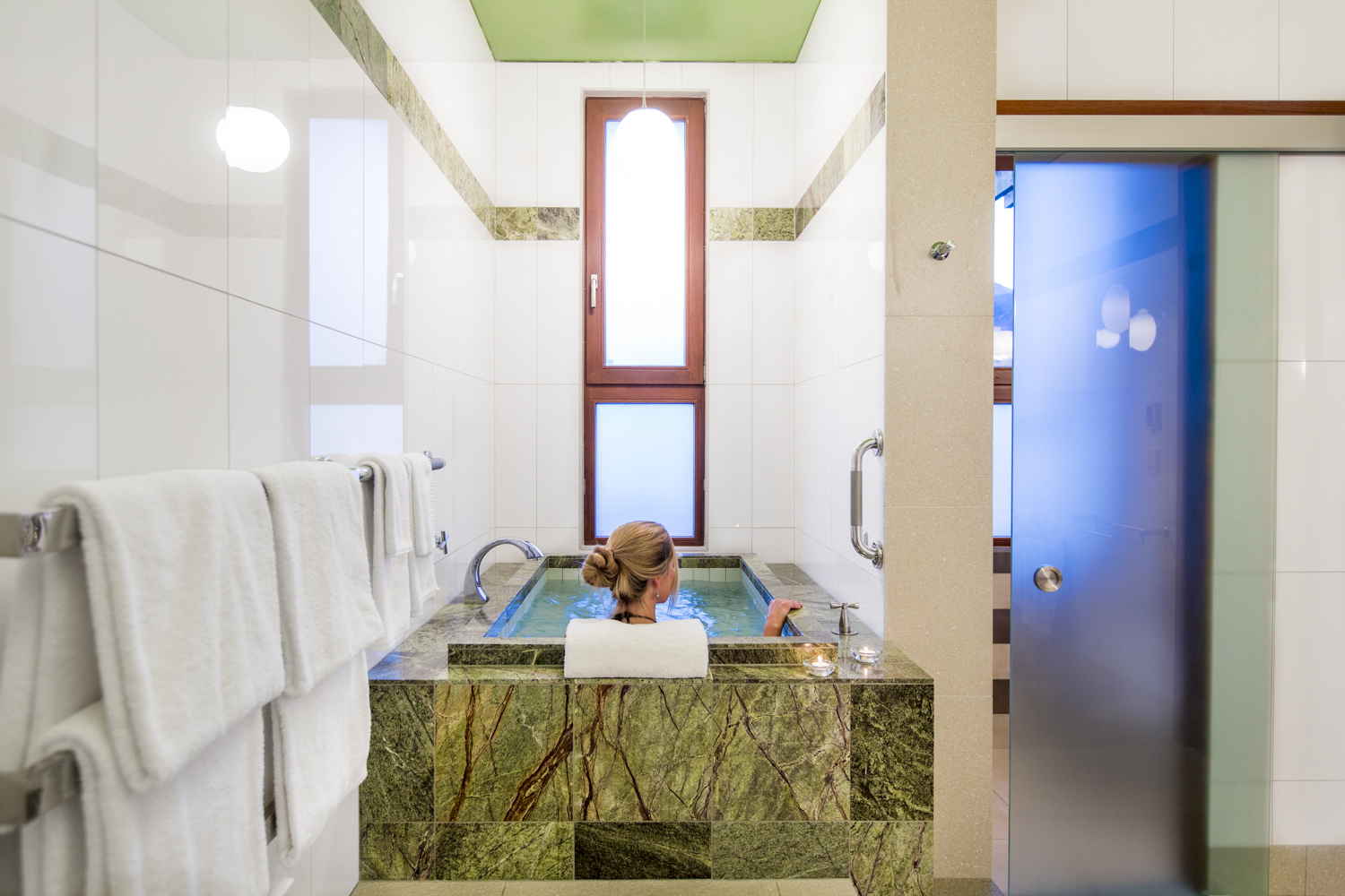 An expansive bathroom features a Japanese soaking tub.