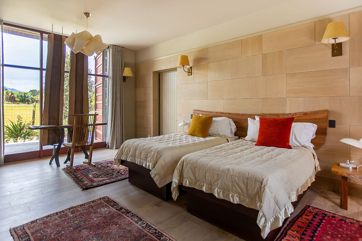 The Olive House's three bedrooms each has a custom made extra-large king bed that can be split into twin beds.