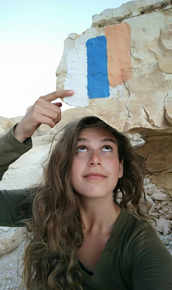 Fellow hiker Denise Stolnik pointing to the beloved trail marker of the Shvil Yisrael