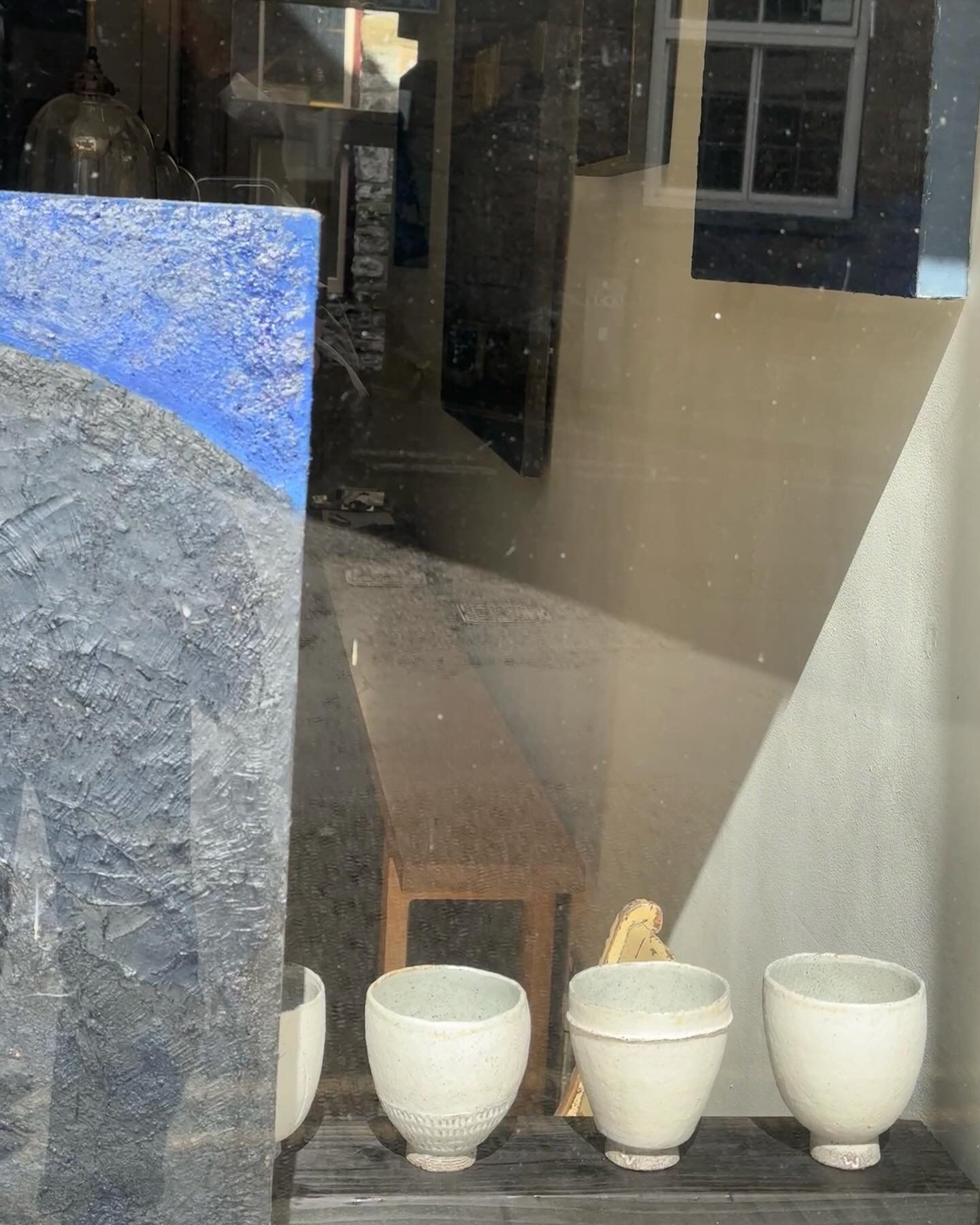 Through the window .. a taster of the window display and reflections of this amazing show opening this Saturday 20th April with paintings by @annettedemestre and ceramics by Clare Walters @p_l_o_u_g_h_s_t_u_d_i_o and if you can&rsquo;t make the PV at