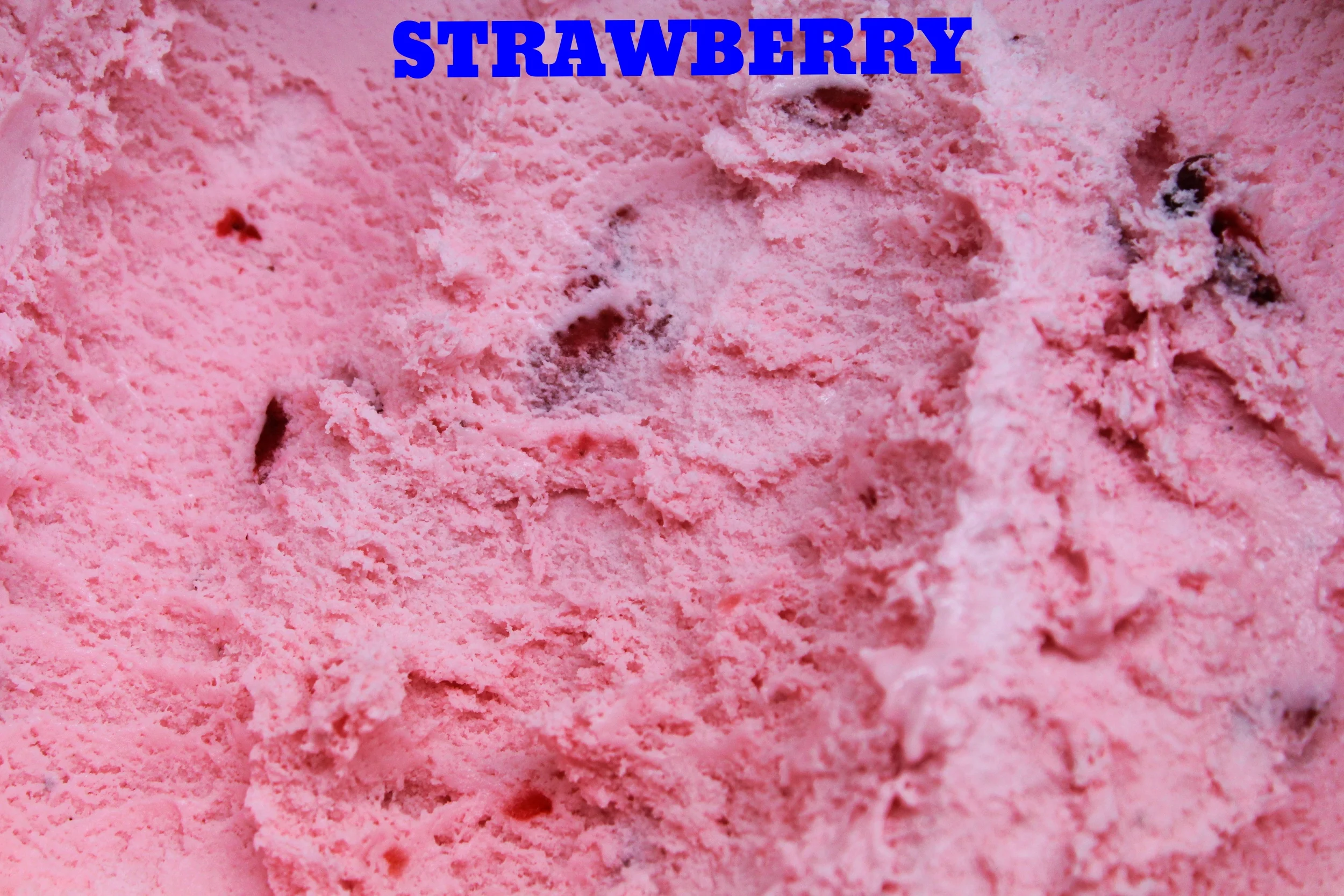   Strawberry ice cream with chunks of strawberries.  
