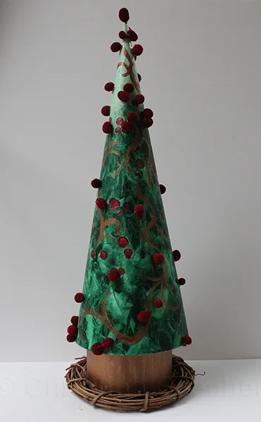 Holly Tree Oil on pressed board, pom-poms on wooden stand.