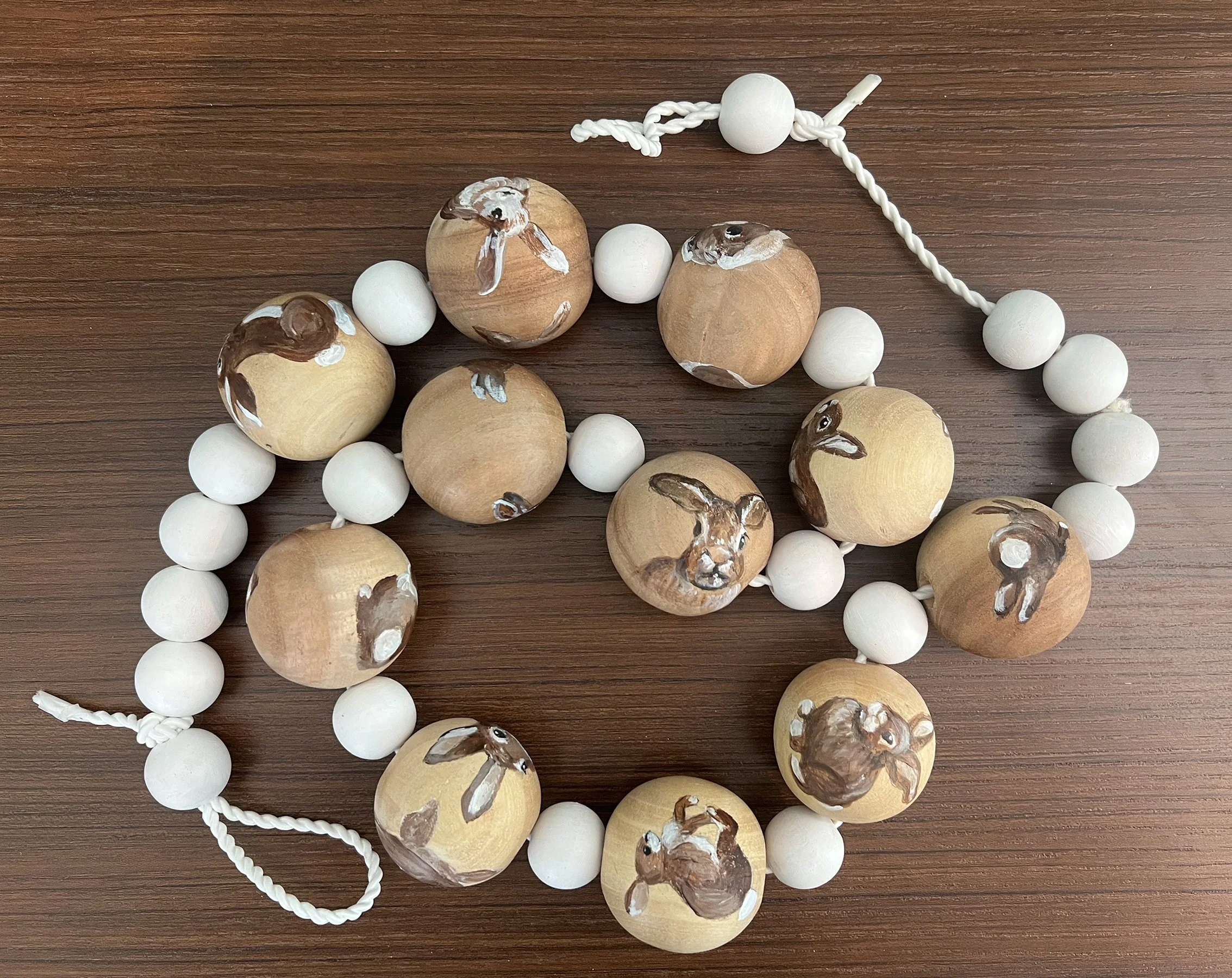 Snowballs and Bunnies. acrylic on wood , white cording (NA)