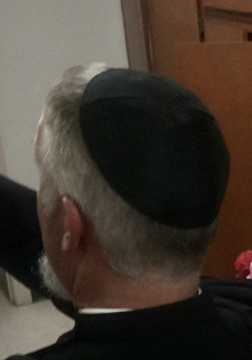 wearing that funny little hat 