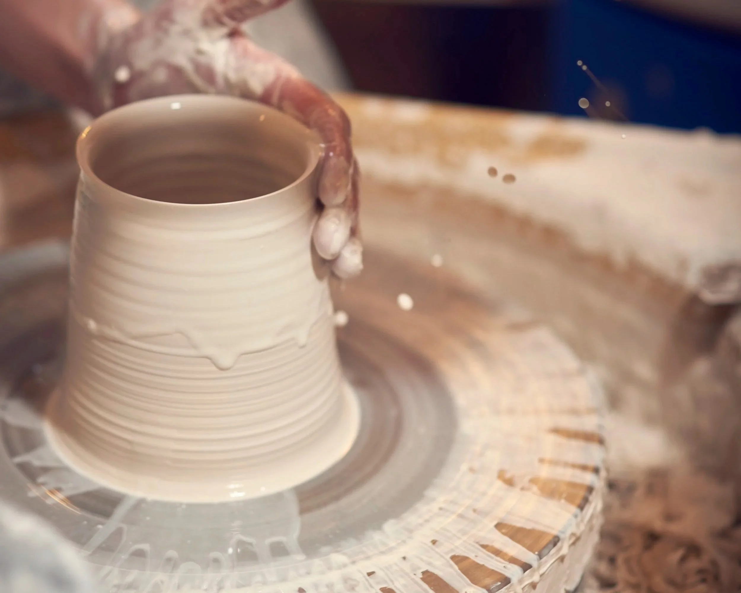 Jo Davies throwing at the pottery wheel