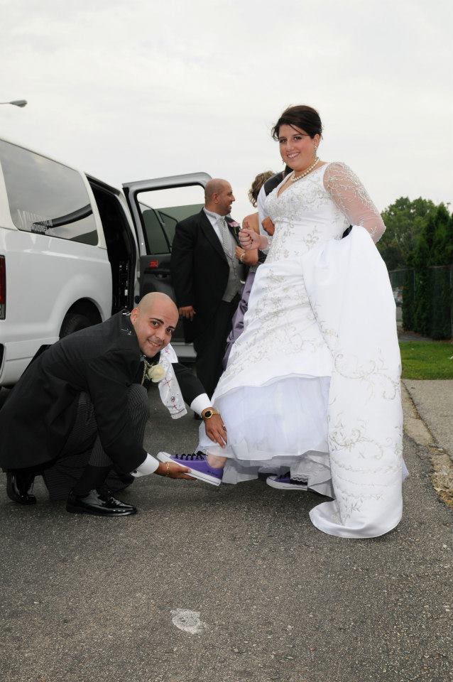 Bride with groom tieing the shoes.jpg