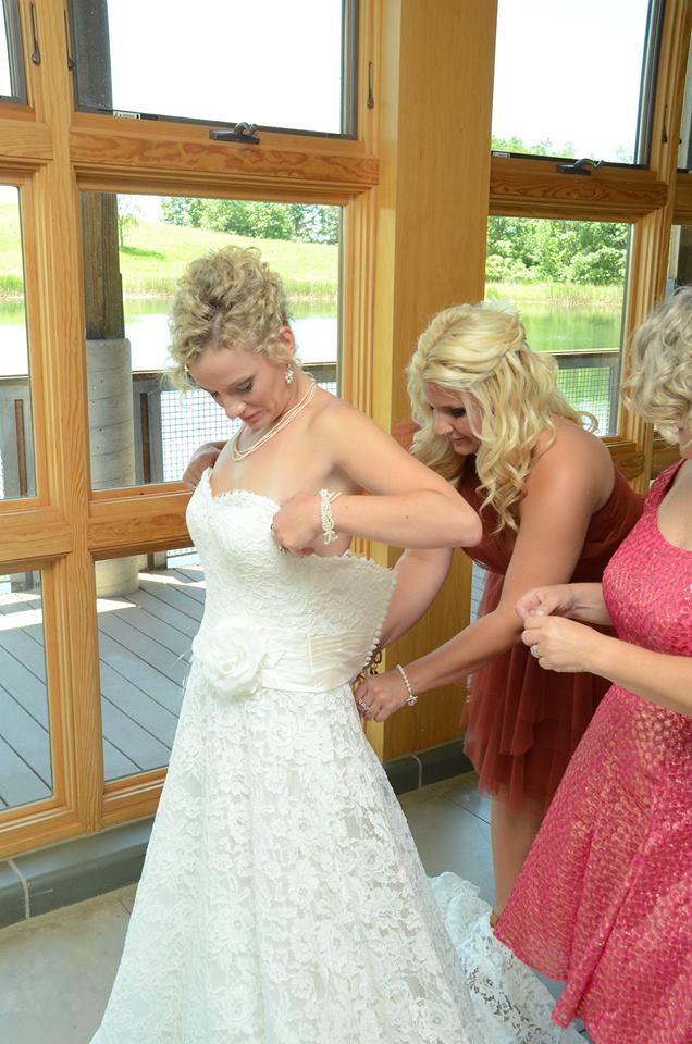 bride getting dresses in gown.jpg