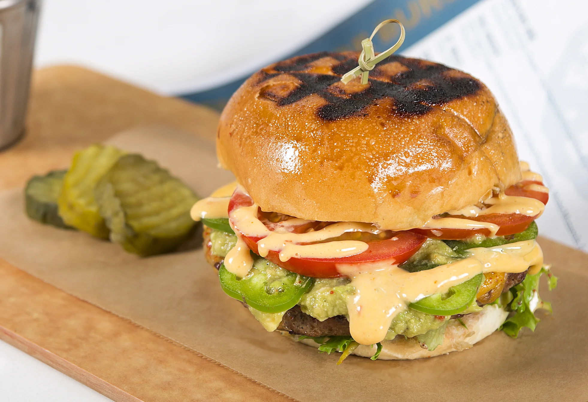 HOT 'N' SPICY Signature Custom Blended Beef Grind, Green Chiles, Guacamole, Local Tomato, Artisan Field Greens, Monterey Jack, Jalapeno, Diablo Dust, Spicy Aioli, Toasted Brioche