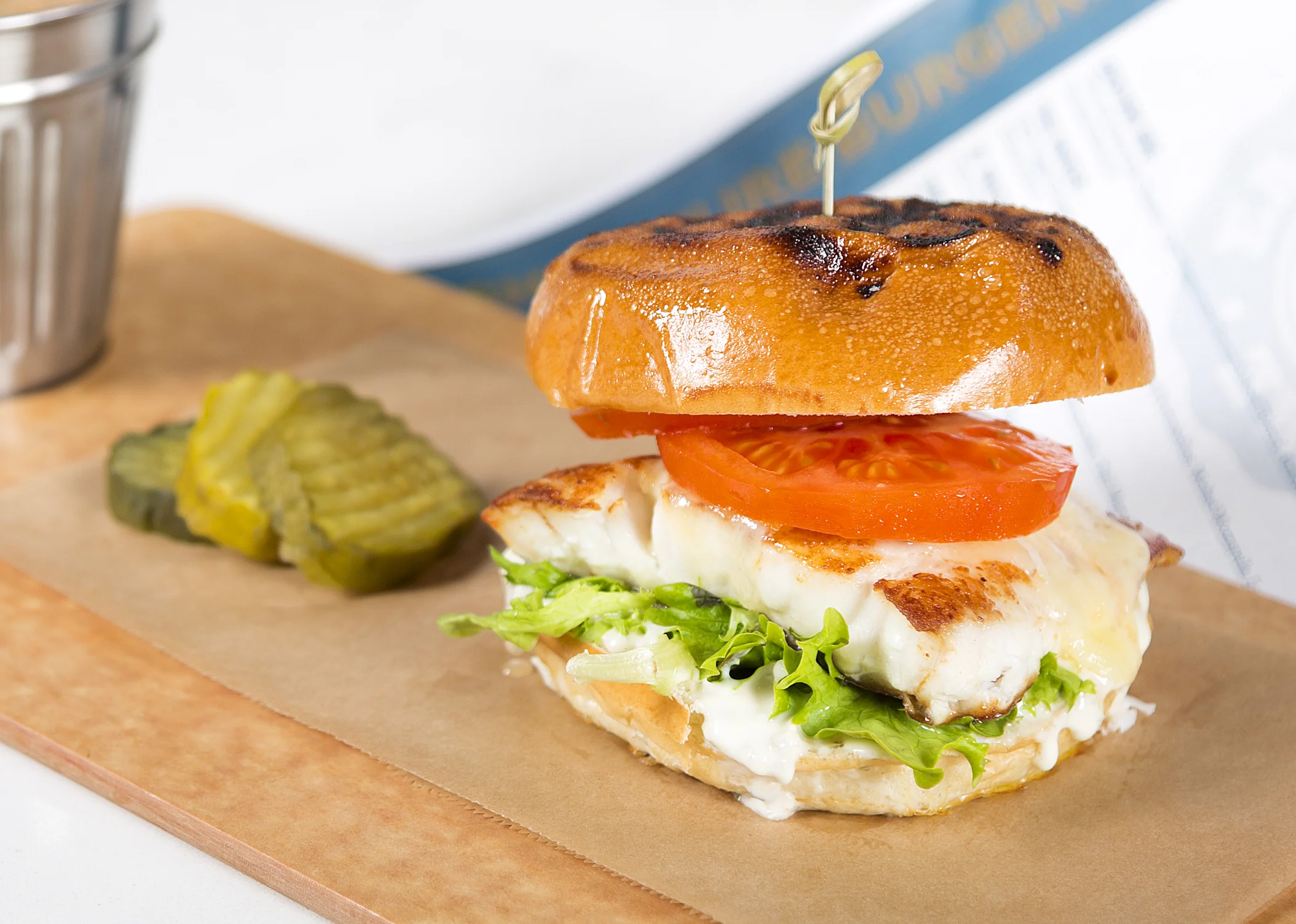 FISH MONGER Grilled Gulf Grouper, Sharp Provolone, Field Greens, Florida Tomato, Avocado, Key Lime Tartar, Toasted Brioche