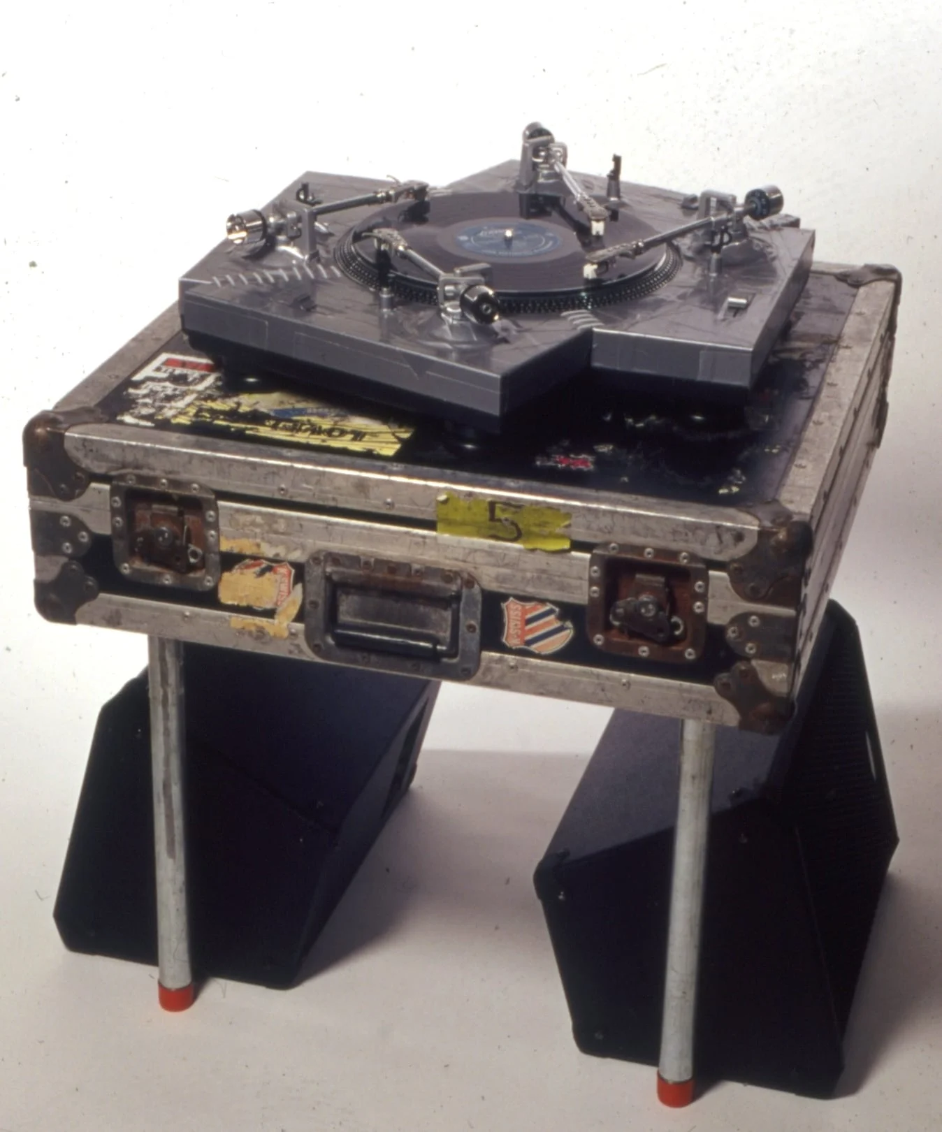  The Creature - 2003 -&nbsp;turntable with four arms, Fender Squire amp &amp; two speakers, seven vinyl albums, gear box -&nbsp;32"h x 28"w x 28"d 
