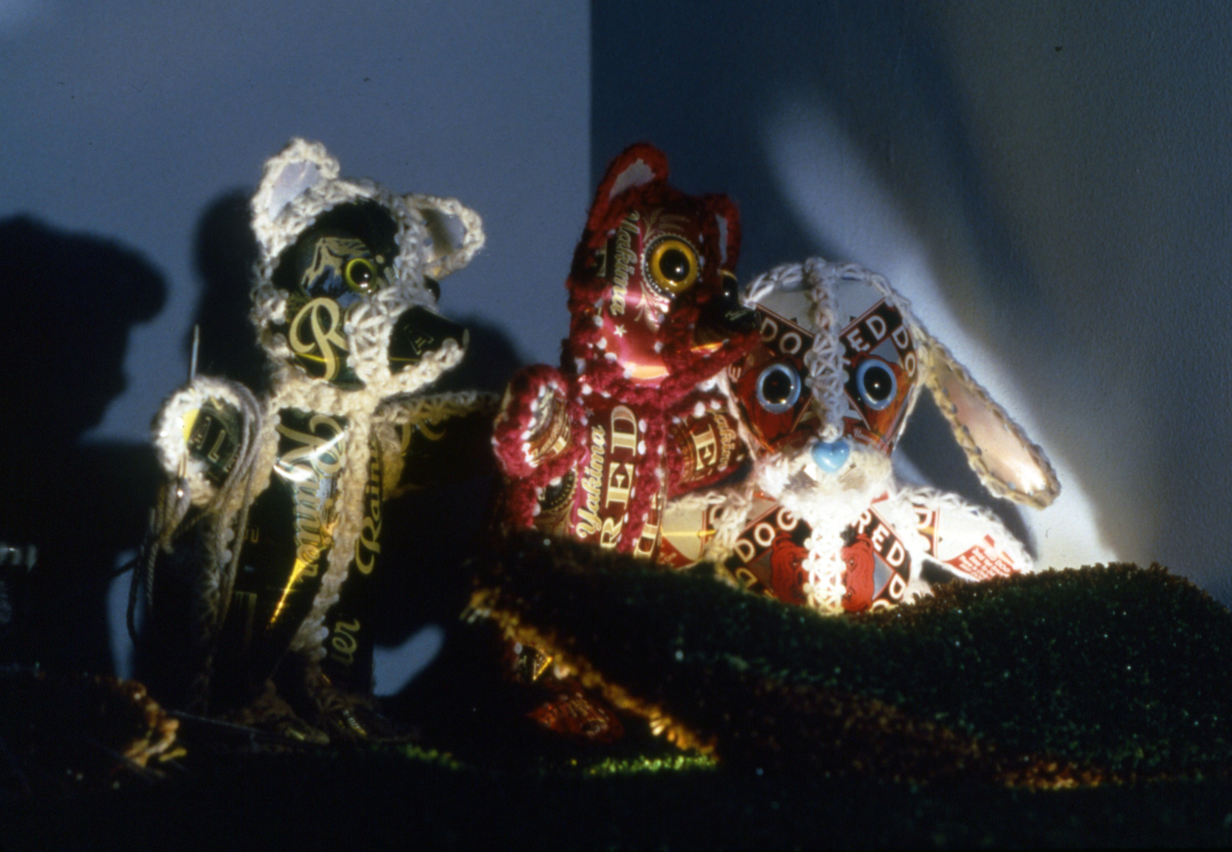 Crack in the Earth (detail) - 1995 - beer cans, yarn, stuffing, astroturf, light fixtures - 36"x44"x24"