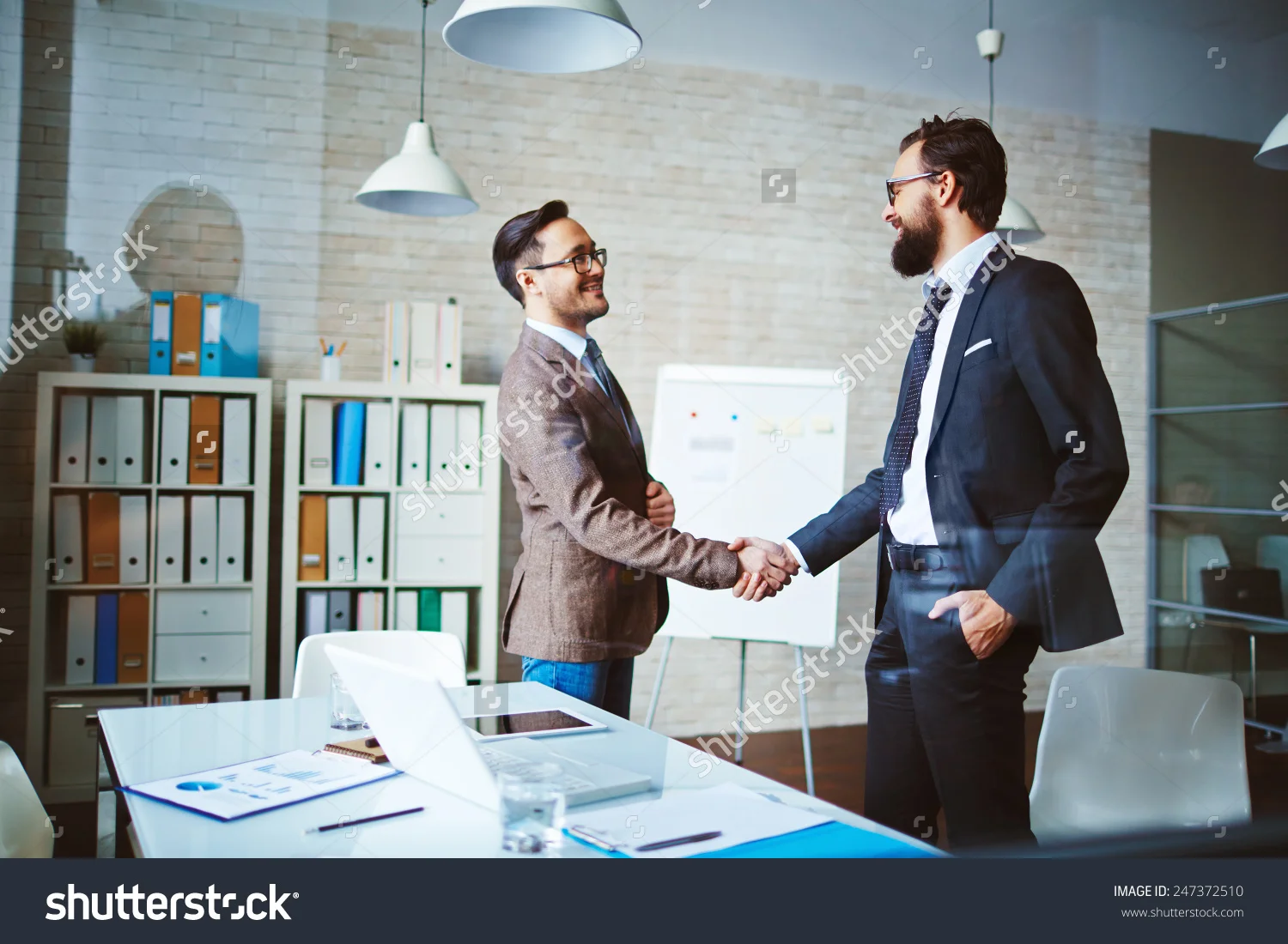 stock-photo-business-team-meeting-handshake-applaud-concept-370921607.jpg